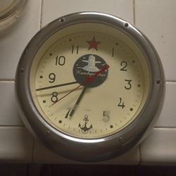 This vintage-style item is a Russian submarine wall clock, 