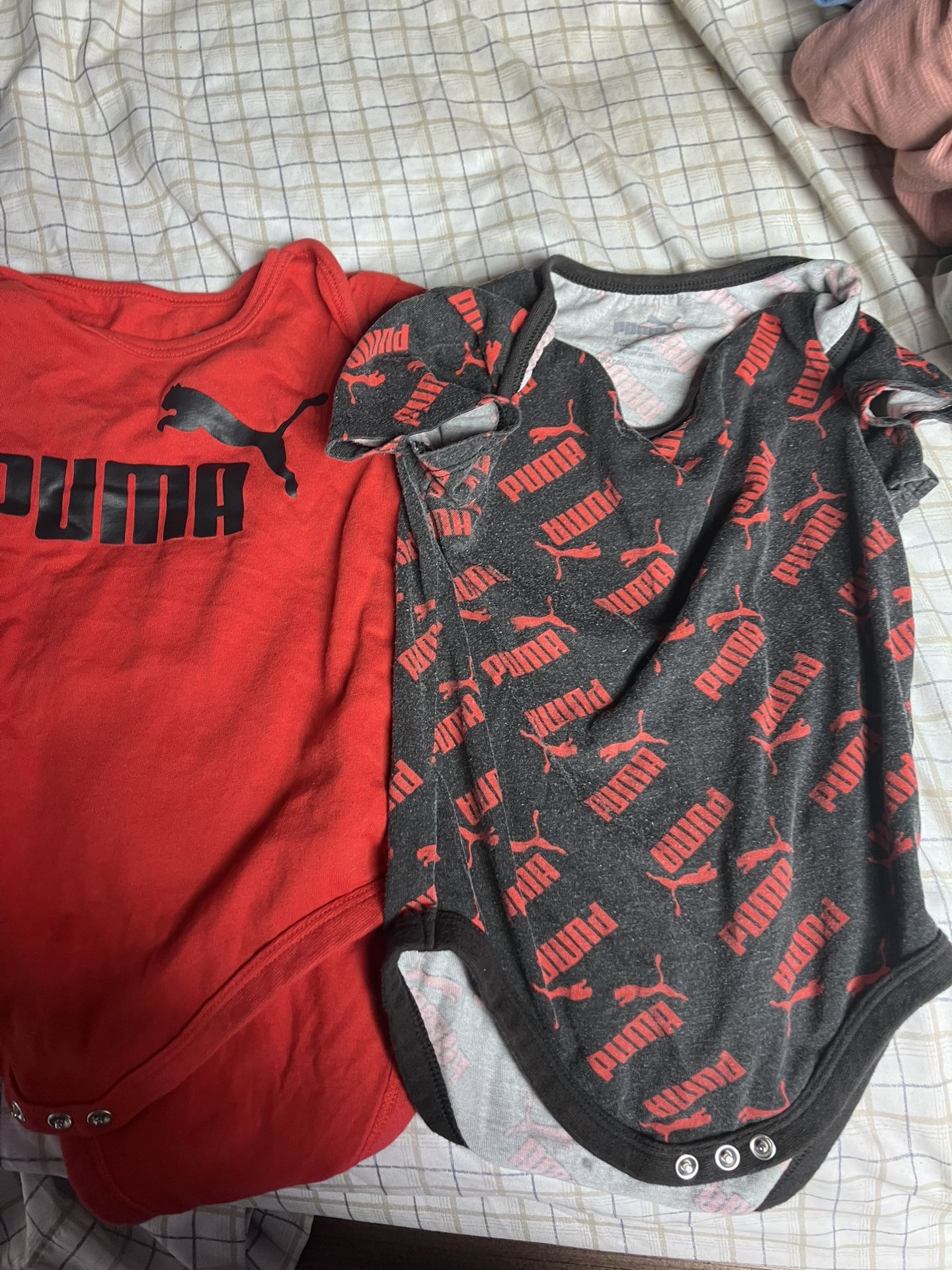 Baby Puma onesies both