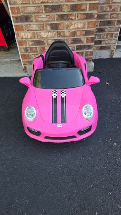 Small power wheels type pink car