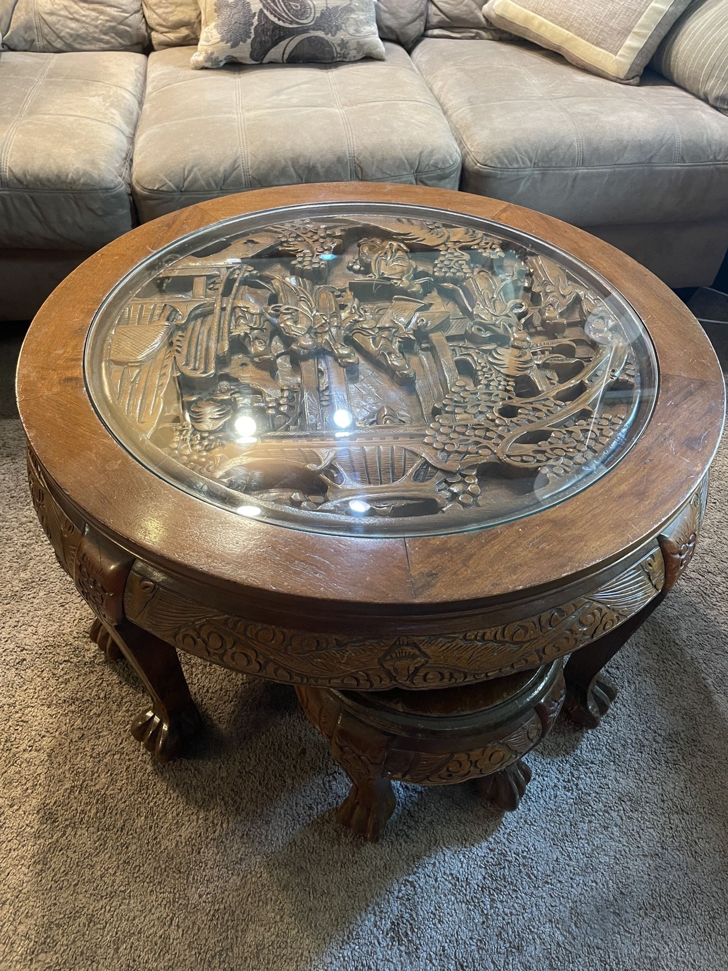 Vintage Chinese Massive Round Carved Coffee Table w/4 Nesting Stools Glass has a scratch and one of the chairs has damage to the seat.