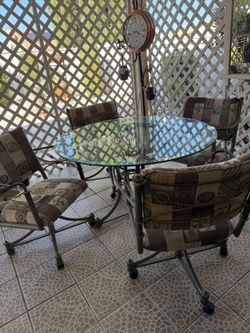 5 piece dinner 4 chairs & glass table everything pictured