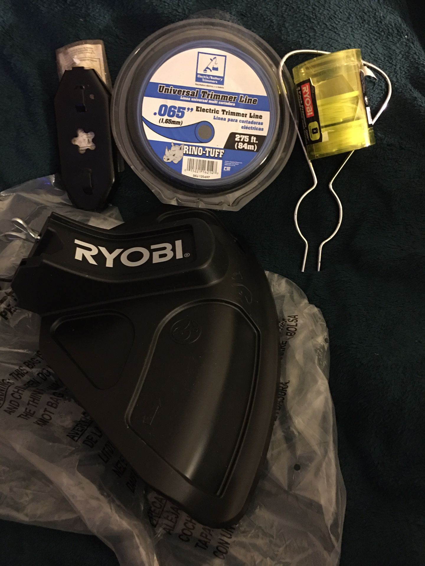BRAND NEW RYOBI 40VOLT TRIMMER HEAD GUARD SHIELD WITH TRIMMER LINE AND TOOLS FOR TRIMMER HEAD $20.00