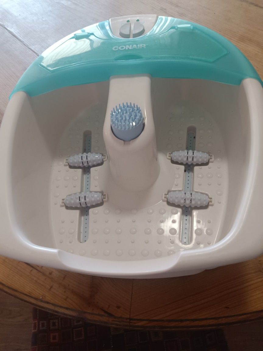 Conair foot spa with massage rollers and brush attachment.
