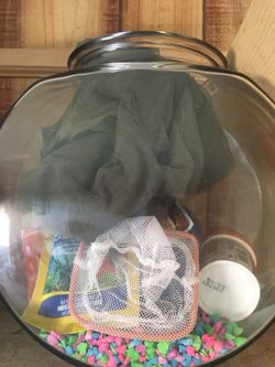 Fish bowl with rocks/net/food etc