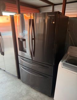Dark Stainless Steel Samsung Refrigerator And Freezer