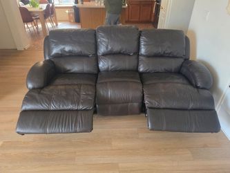 Brown leather double recliner couch