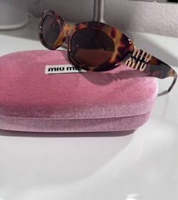 Miu Miu Oval Sunglasses