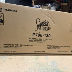 Signature Design by Ashley Seton Creek Casual Nuvella Weather Resistant Fabric, Resin Wicker Swivel Outdoor Bar Height Bar Stool with Cushion, Footres