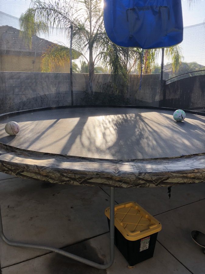 15 foot trampoline with basketball hoop, 6 mos old