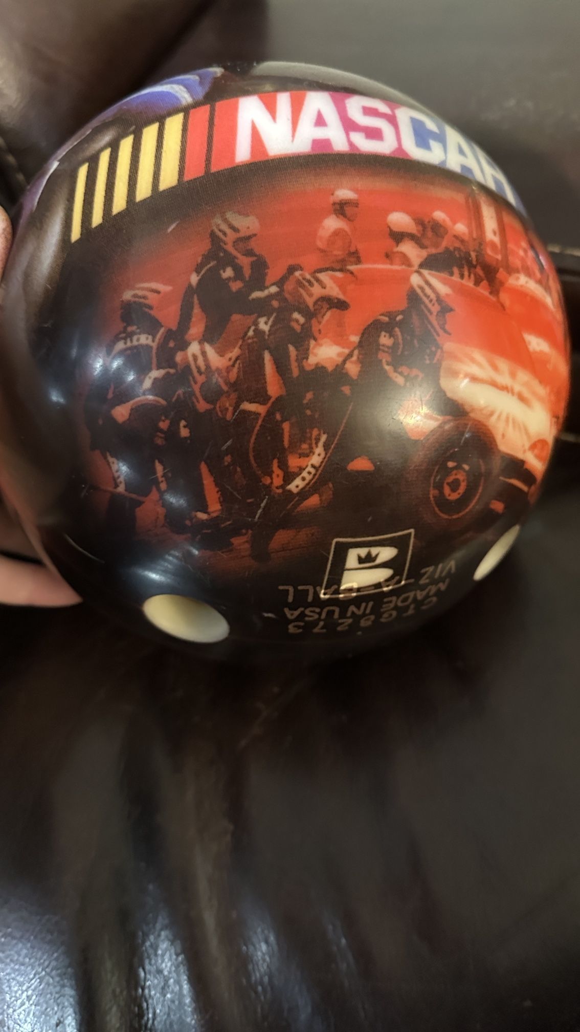 Brunswick NASCAR Viz-A-Ball bowling ball. • It features a visual design related to NASCAR racing. • The specific model in search results wei