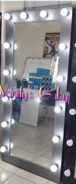mirror available $500, new, has light regulator and outlet, gray color, I am located by federal and first, measures 72" x 32"
