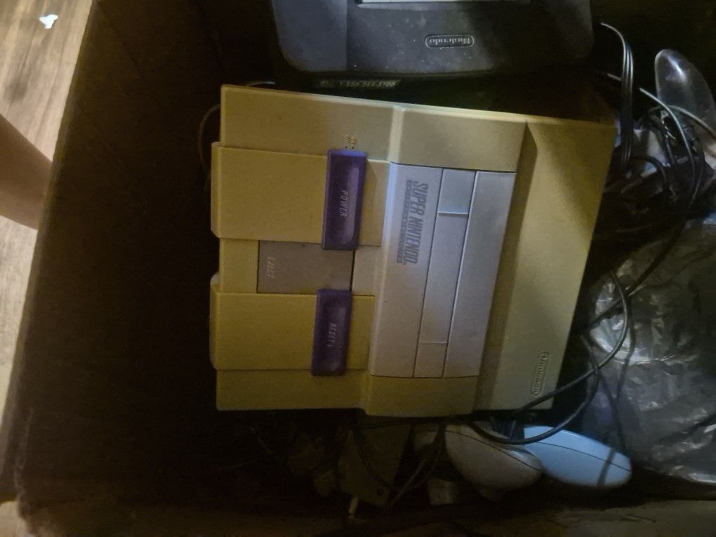 Video Game Console With Cords And Controllers
