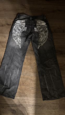 black pants with wing design 