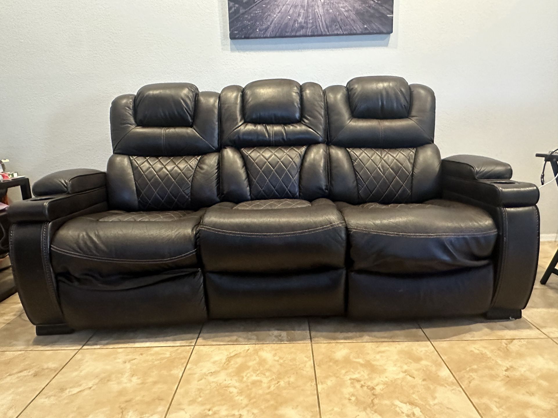Brown Leather Power Reclining Sofa with Drop Down Table.