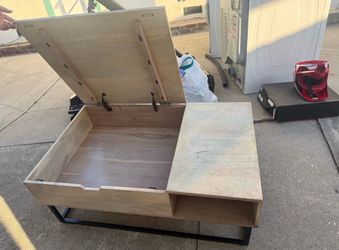 Coffee table with lid that opens