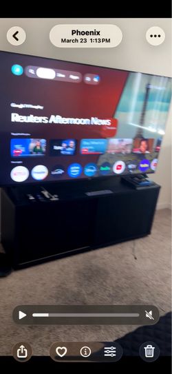 75 inch Phillips tv and black tv stand