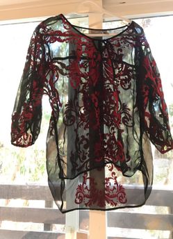 Chicos top size 0. Sheer with velvet embossed fabric.