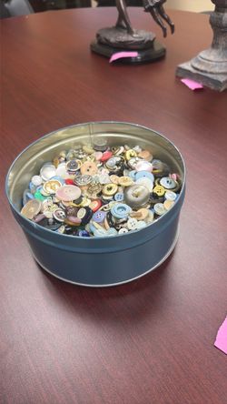 Tin of buttons