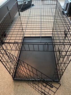Dog Crate - measures 42”L x 28” W x 31”H.