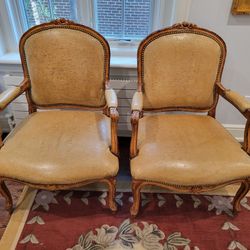 Pair of Exotic Tanned Leather and Ostrich Finish Wood French Provincial Arm Chairs, BRad Accents, Ochre Colored Cushions MUST SEE