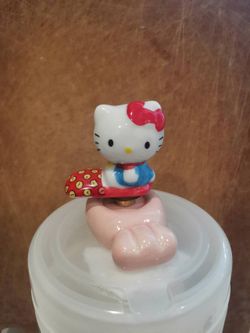 Cute mini ceramic figurine with a rotating base.