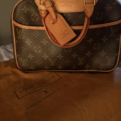 Louis Vuitton Monogram Trouville Bag. 