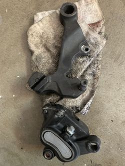 Dyna 06+ caliper and bracket.