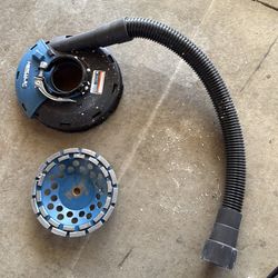 Concrete grinder with dust shroud