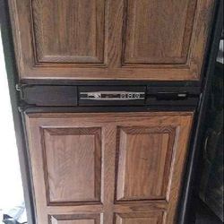 Norcold RV Refrigerator with wood paneling, dual fuel (gas + electric), 