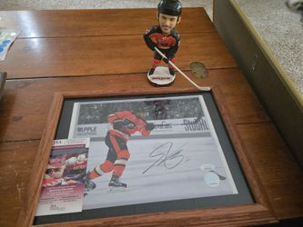 Framed autographed photo of former flyer shayne gostisbehere with coa