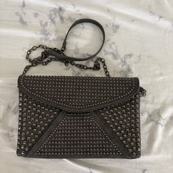 Riveted, chain purse
