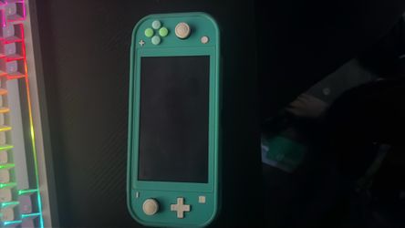 Nintendo Switch Lite – Great Condition With Game