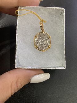 Atocha silver coin pendant in gold bezel