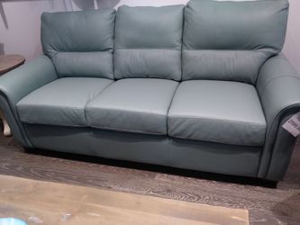Omnia sofa and matching chair in our showroom at Timber and Hided Citrus Park Mall.