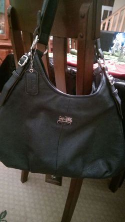 Navy blue leather Coach.