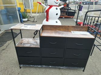 8 drawer Dresser tv stand with Charging station
Wooden top, metal frame, fabric drawer 
brand new $130