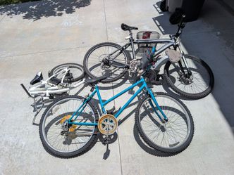Two bikes, baby carrier and tandem attachment