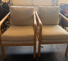 Threshold beige tufeled wood armchairs