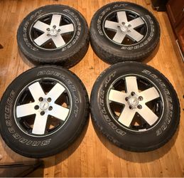 4 jeep rims and Bridgestone Dueler tires