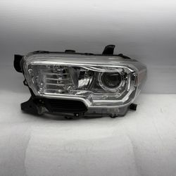 16-23 Toyota Tacoma Driver Side LT Headlight OEM 