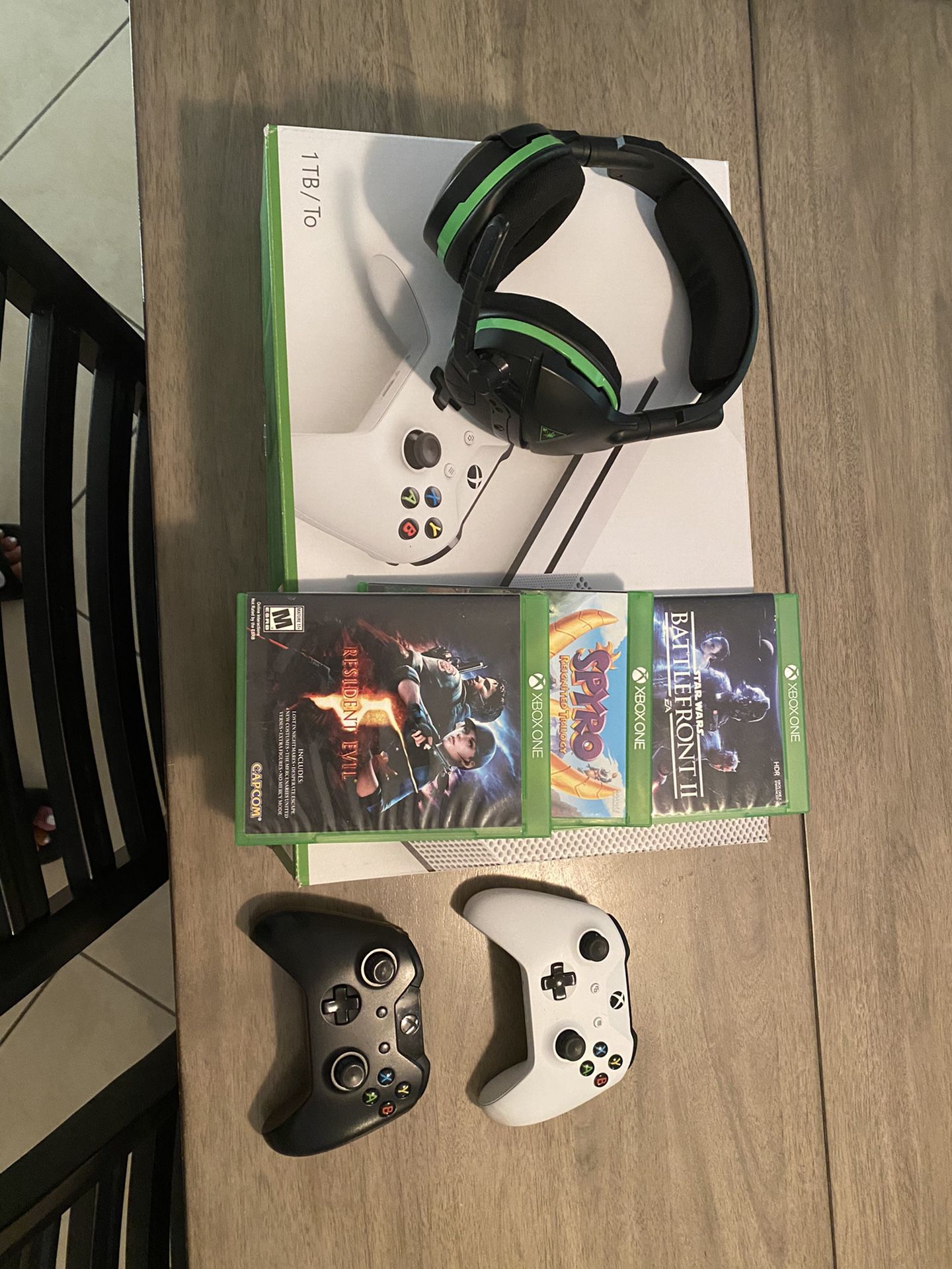 Xbox one S with a head set 2 controllers and 3 games