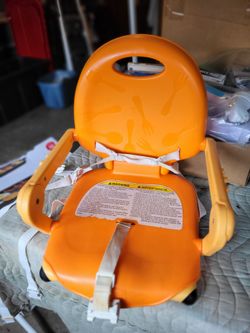 Portable infant dinner chair. Folds flat