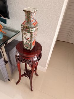 Two small Chinese vases with wooden stand