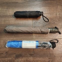 3 Folding Umbrellas for $10 good condition, new and used