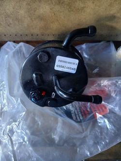 Remanufactured power steering pump with reservoir