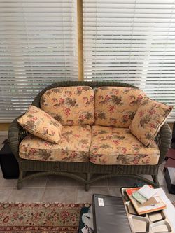 Wicker Loveseat with Floral Cushions