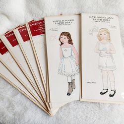 Vintage Lot of 7 Paper Dolls Depicting the Late 19th and Early 20th Century Little Girls. 6 Phyllis Marie Dolls 1873-76 and 1 Katerine-Ann Doll 1905-0