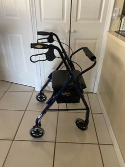 Winnie Walker, 4 -wheel walker with seat and basket