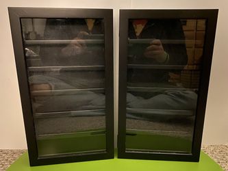 Black display cases with six shelves