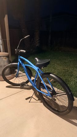 Matte blue flat black beach cruiser bicycle
